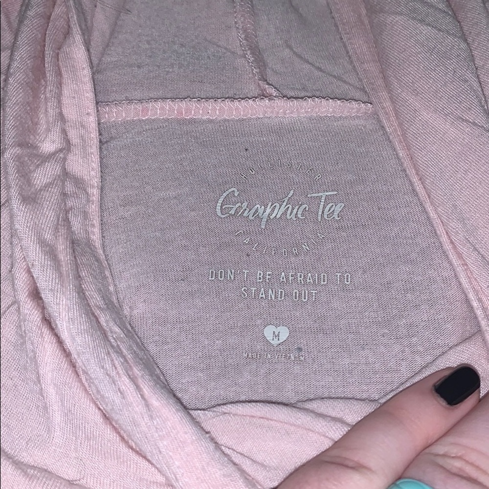 Light pink Hollister ling sleeve graphic tee.
